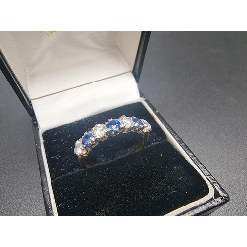 164 - An 18ct gold sapphire and diamond seven stone ring, set four diamonds, totalling approximately 1ct a... 