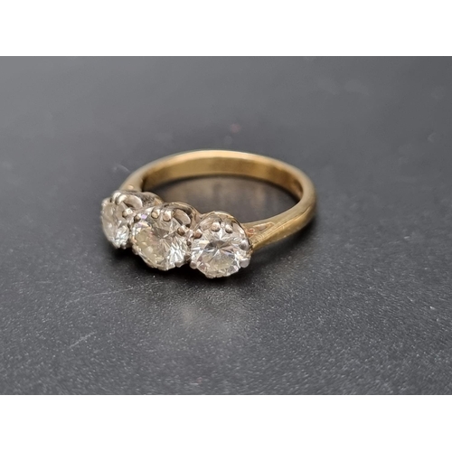 166 - An 18ct gold diamond three stone ring, estimated total of 1.75 -2ct, size P 1/2, gross weight 5.9g.... 