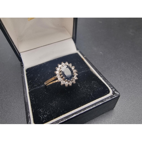 172 - A 9ct gold sapphire and diamond cluster ring, size O, gross weight 2.3g.