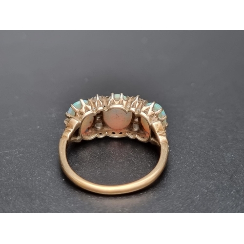 174 - A yellow metal ring, set three cabochon opals and eight graduated mine cut diamonds, size O.... 