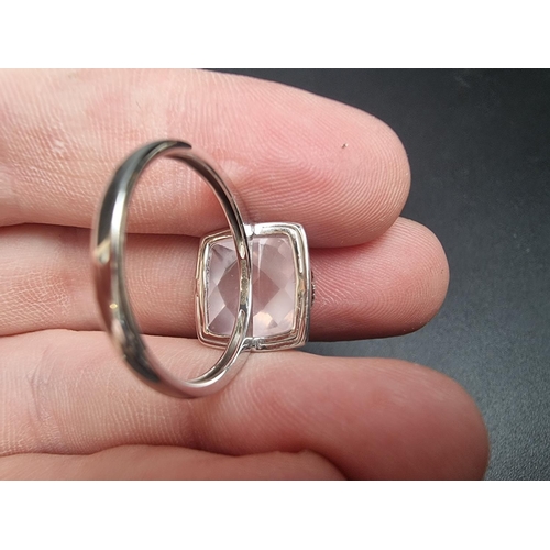 177 - A 9k white gold ring, set rose quartz with four strands of diamonds, size N, gross weight 3g.... 