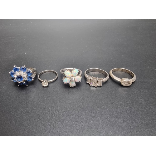 191 - Five various white metal and metal rings, to include an opal set example.