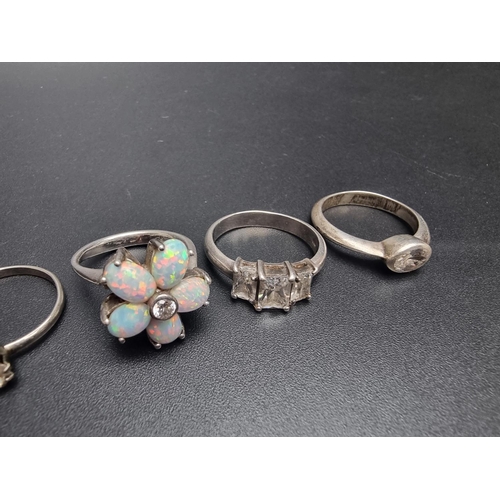 191 - Five various white metal and metal rings, to include an opal set example.