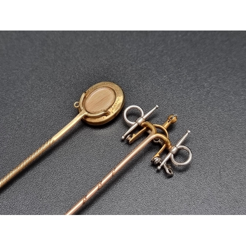 203 - A 19th century yellow metal and carved agate stick pin, the reverse inset hair and inscribed 'Llewel... 