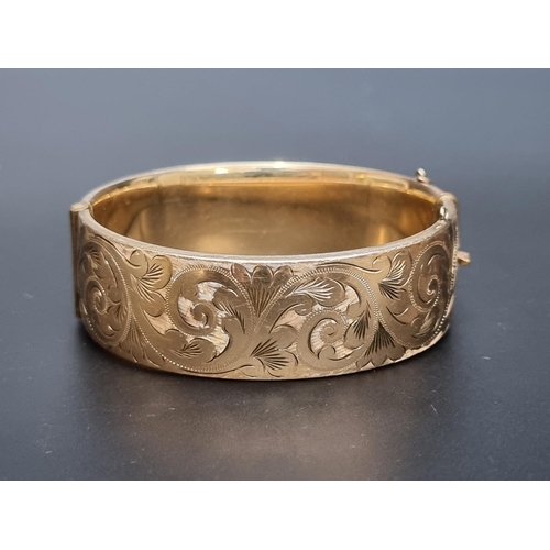 206 - A 9ct rolled gold hinged bangle, by Georg Jensen Ltd.