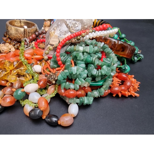 228 - A coral necklace; together with various natural stone necklaces and costume jewellery.... 