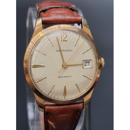 245 - A 1960s Garrard & Co. 9ct gold automatic wristwatch, 33mm, hallmarked London 1966, on a replacem... 