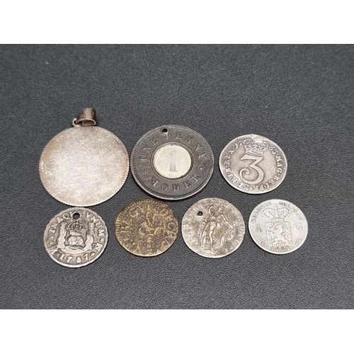 297 - Coins: a George III 1763 silver Maundy threepence; together with six other various coins and tokens.... 