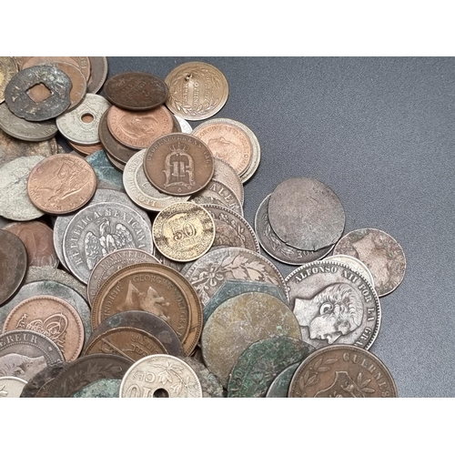 322 - Coins: an interesting group of UK and world coins and tokens. (qty)