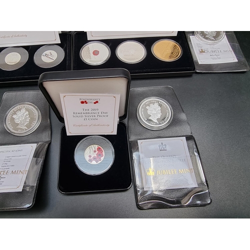 328 - Coins: two Jubilee Mint boxed collectable coin sets, comprising: 'The World War II' Silver Proof Coi... 