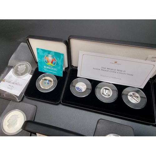 328 - Coins: two Jubilee Mint boxed collectable coin sets, comprising: 'The World War II' Silver Proof Coi... 