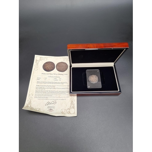 331 - Coins: a cased Philip & Mary 1554 silver shilling, with CoA.