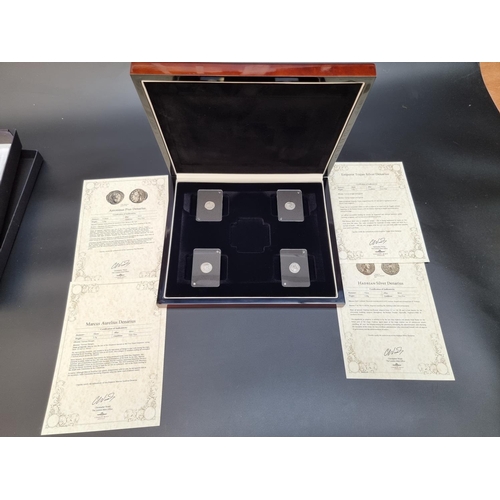 366 - Coins: a cased set of four Roman Empire hammered silver Denarius, comprising: Trajan (98-117 AD); Ha... 