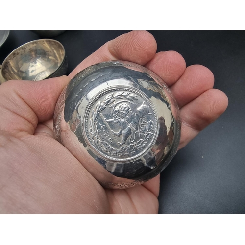 84 - A metal ashtray, inset US 1921 silver $1 coin; and four other metal items. (5)