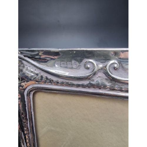 90 - An ornate silver mounted easel photograph frame, by Neil Lasher Silverware Ltd, London 1992, 32cm hi... 