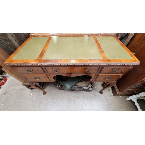 1026 - A 1930s walnut kneehole desk, 107cm wide. 