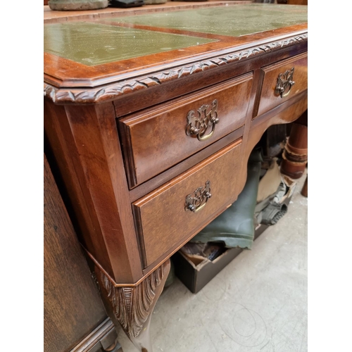 1026 - A 1930s walnut kneehole desk, 107cm wide. 
