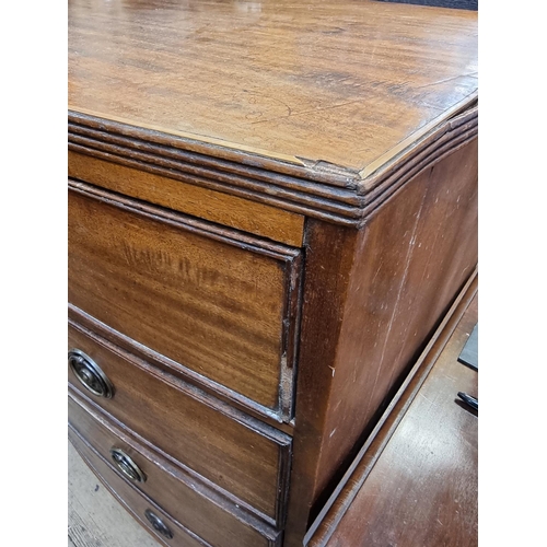 1056 - A George III mahogany and line inlaid bowfront chest of drawers, 107cm wide.