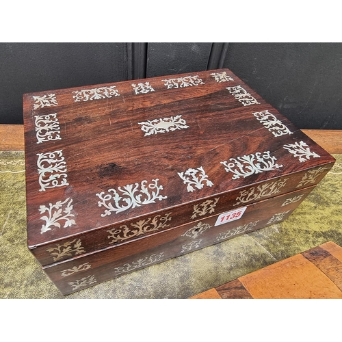 1135 - A Victorian rosewood and mother-of-pearl casket, 28cm wide; together with a rosewood and mahogany gl... 