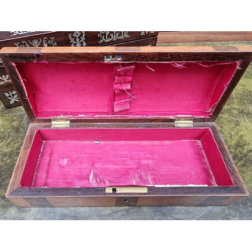 1135 - A Victorian rosewood and mother-of-pearl casket, 28cm wide; together with a rosewood and mahogany gl... 