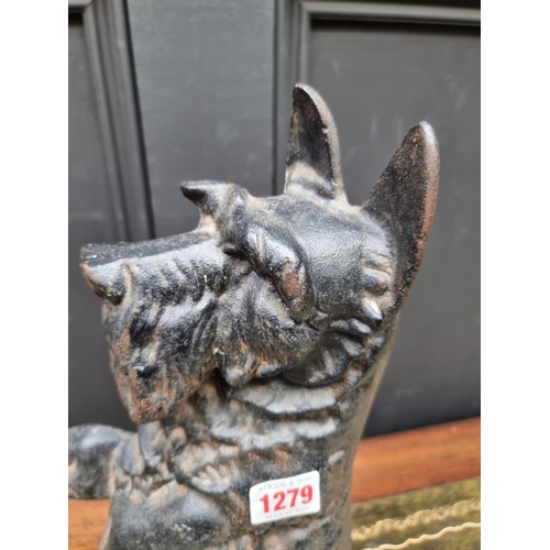 1279 - A cast iron Highland Terrier doorstop, 37cm high.