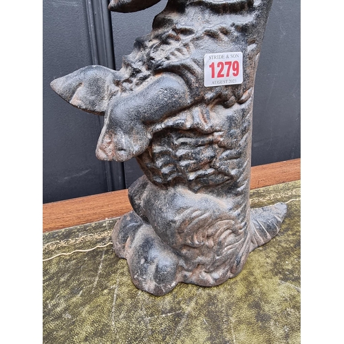 1279 - A cast iron Highland Terrier doorstop, 37cm high.