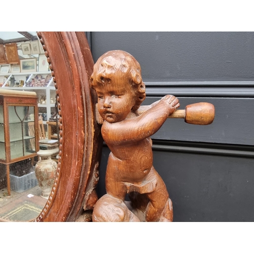 1346 - An antique Continental carved pine dressing table mirror, 79cm high, (damage and losses).... 