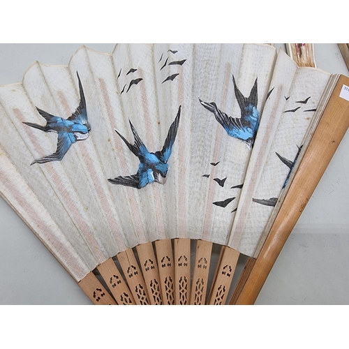 1396 - Five fans, to include a painted silk and bone example; and another painted with swallows. ... 