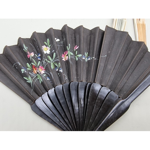 1396 - Five fans, to include a painted silk and bone example; and another painted with swallows. ... 