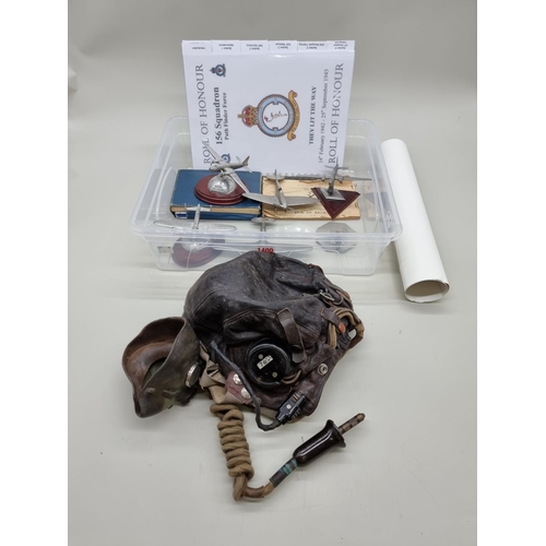 1400 - A mixed group of RAF related items, to include a leather pilot's helmet; and logbook. ... 