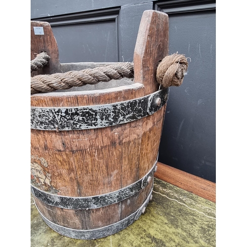 1418 - A coopered oak bucket, with rope handle and emblazoned with the Royal Standard; together with a... 