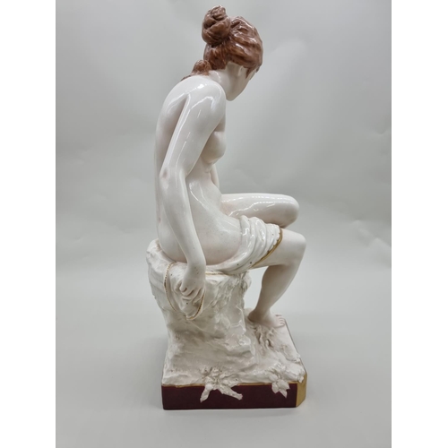 1499 - A large Royal Dux seated nude, 46cm high. 