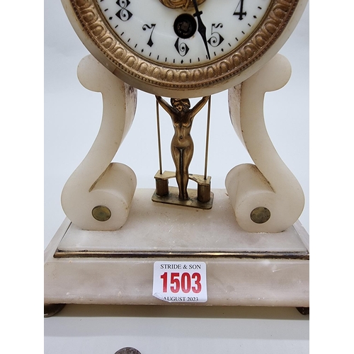 1503 - A late 19th century French alabaster portico style timepiece, with novelty brass nude on swing pendu... 