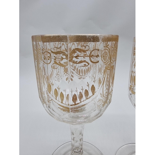 1509 - A pair of antique clear and cut glass goblets, with facetted stems, 19cm high.