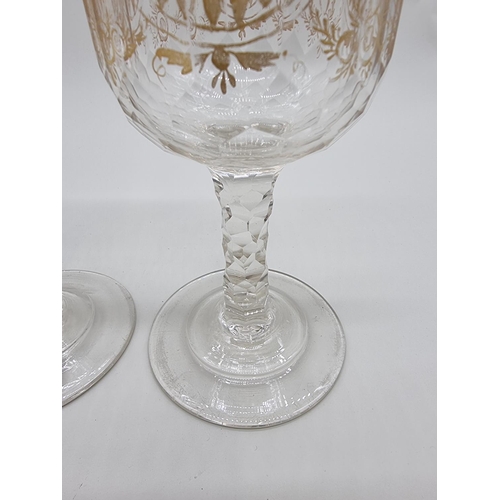 1509 - A pair of antique clear and cut glass goblets, with facetted stems, 19cm high.