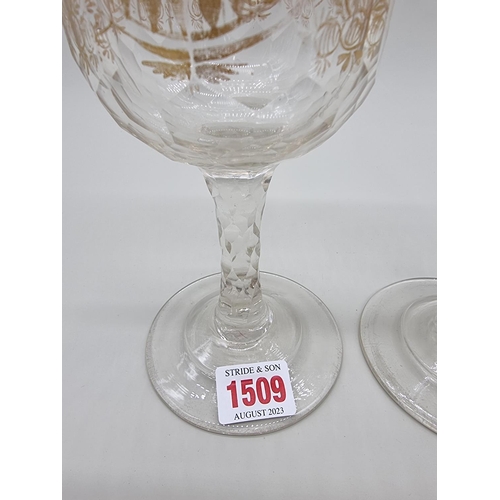 1509 - A pair of antique clear and cut glass goblets, with facetted stems, 19cm high.