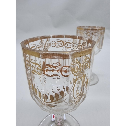 1509 - A pair of antique clear and cut glass goblets, with facetted stems, 19cm high.