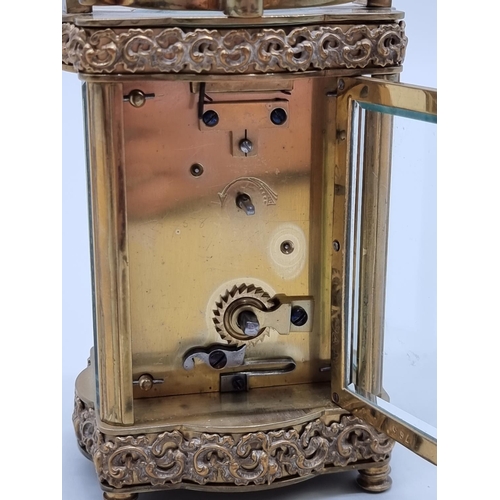 1519 - An antique brass carriage timepiece, the dial inscribed 'Deane & Co, Londonderry', height i... 