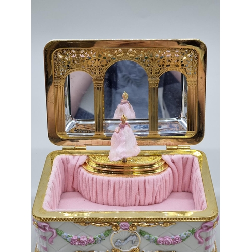 1525 - WITHDRAWN FROM AUCTION - A Franklin Mint 'House of Faberge' musical jewellery box, 20cm wide.... 