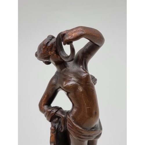 1527 - A bronze female nude dancer, on socle base, 20cm high.