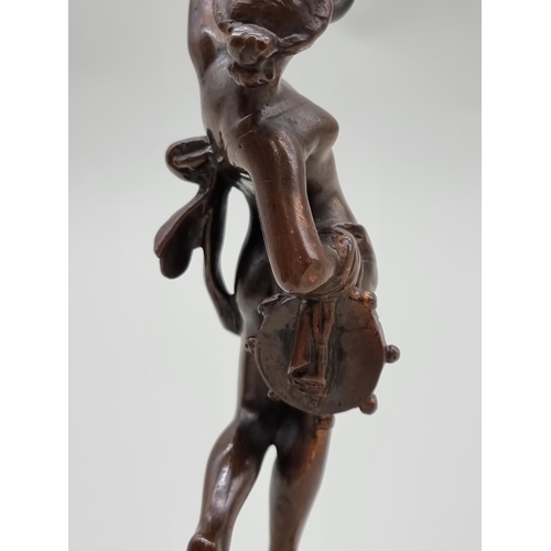 1527 - A bronze female nude dancer, on socle base, 20cm high.