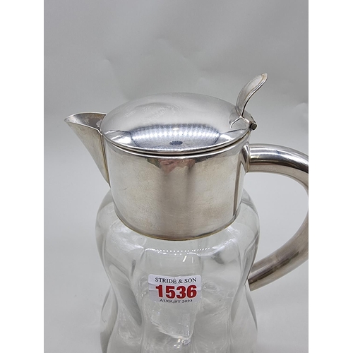 1536 - An electroplated clear glass lemonade jug and liner, 28cm high.