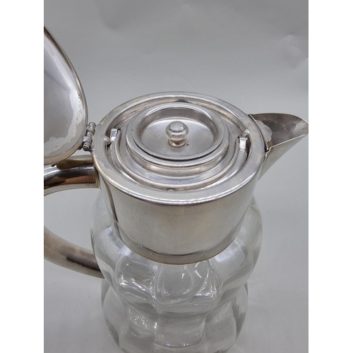 1536 - An electroplated clear glass lemonade jug and liner, 28cm high.