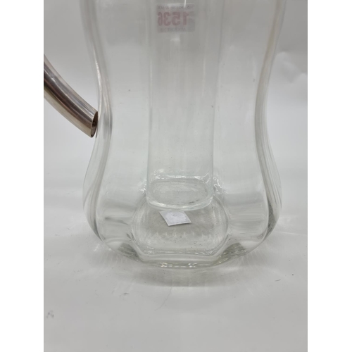 1536 - An electroplated clear glass lemonade jug and liner, 28cm high.