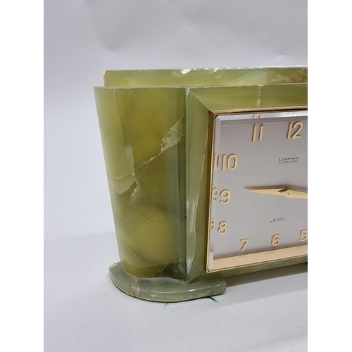 1537 - A green onyx mantel timepiece, the dial inscribed 'Looping', 21.5cm wide.