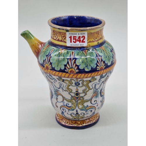 1542 - An Italian maiolica drug jar, 17.5cm high, (chips).