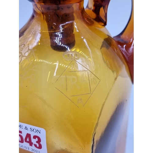 1543 - A Victorian amber glass whisky jug and mother of pearl stopper, with etched registration lozenge, he... 