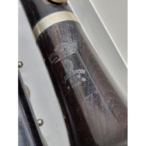 1568 - A Couesnon & Cie clarinet, in case, with accompanying early 20th century Keith Prowse & Co. ... 