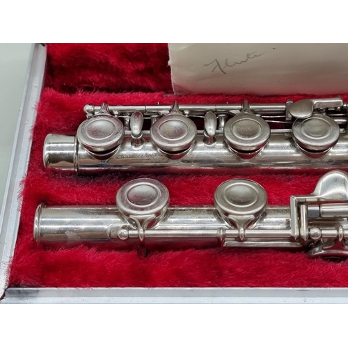 1570 - A Boosey & Hawkes Regent electroplated flute, in padded case. 