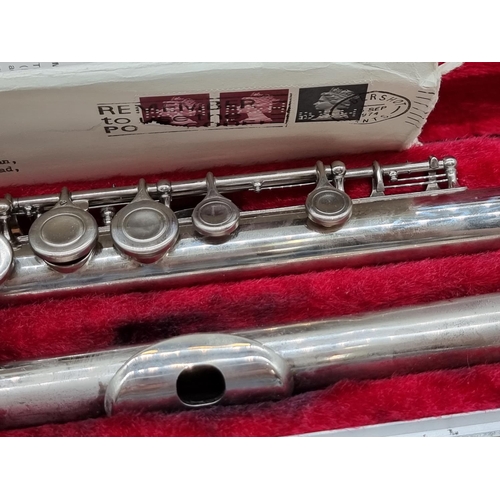 1570 - A Boosey & Hawkes Regent electroplated flute, in padded case. 